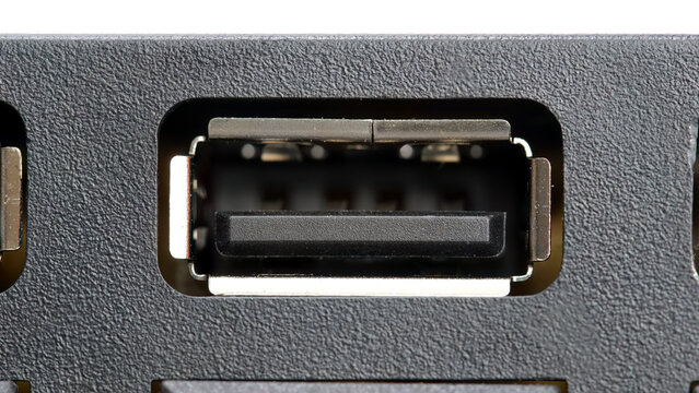 Macro closeup of an USB type A female port on a computer device, frontal view of empty standard interface connector socket, input output power charging and data transfer concept, back panel detail