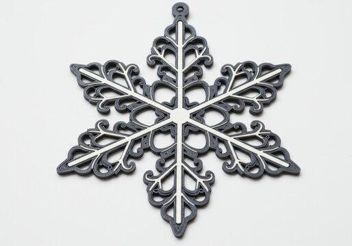 A beautiful vintage silver snowflake ornament with a seamless ornate floral pattern design