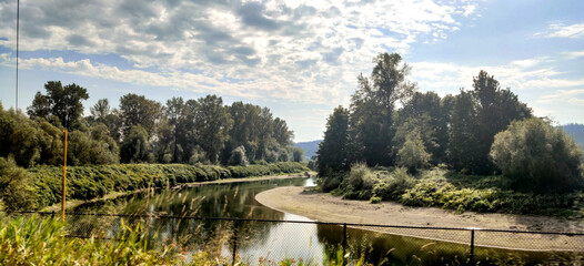 Fototapeta premium A river flowing through the countryside