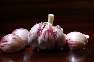 Brazilian spices. Garlic cloves on the rustic table.