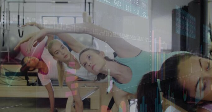 Pilates participants on cue lifting arms into synchronized side-bend on reformers for core stretch