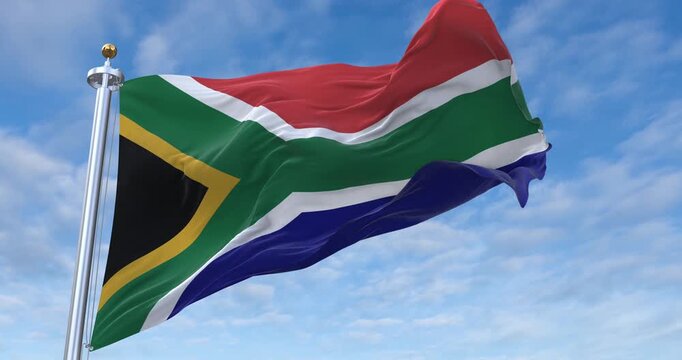 South Africa flag with flagpole waving in wind, rolling clouds background looping, 4K video (Perfect Loop)