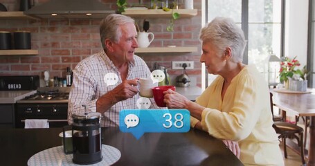 Chat bubble rising over table driving message growth, couple toasting coffee mugs marking milestone