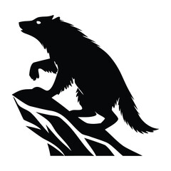 Wolf on a rock silhouette