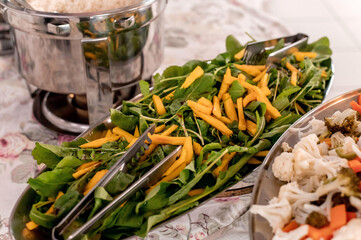 Delicious table with arugula salad with mango