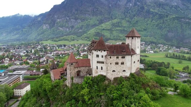  Liechtenstein. beautiful medieval castles of Europe -  Gutenberg border with Switzerland, surrounded by Alps mountains, aerial drone footage