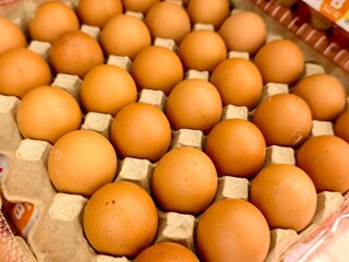 A carton full of eggs, a simple yet satisfying sight.