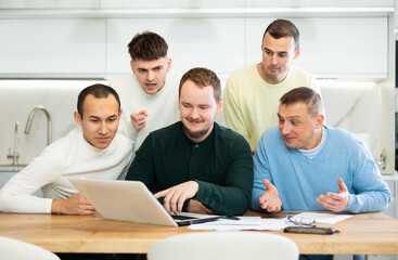 Fototapeta premium Group of friends communicate via video conference using laptop