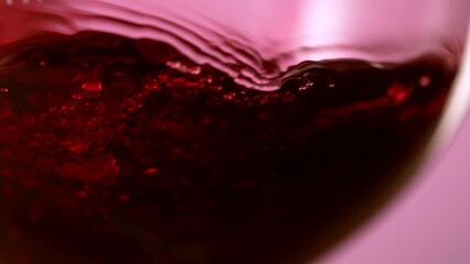 Abstract close up of red wine pouring into glass - Powered by Adobe