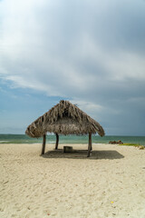 View of the ocean through the beach cabin. Wonderful beach landscape with clean white sand