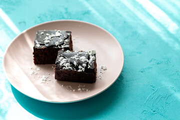 Vegan chocolate brownie on plate close up