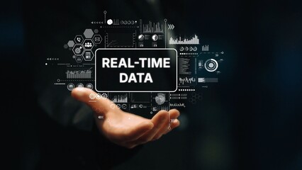 Businessman Holding Digital Interface with Real-Time Data Analytics and Graphs for Business Insights and Decision Making. Asymptotic smart data analytic.