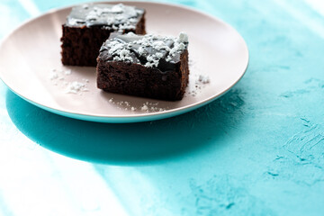 Vegan chocolate brownie on plate close up