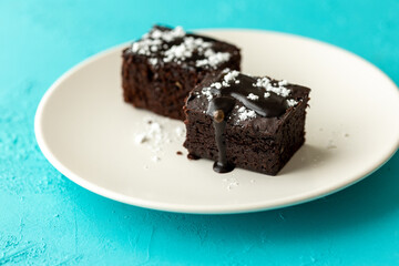 Vegan chocolate brownie on plate close up