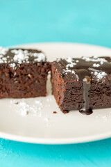 Vegan chocolate brownie on plate close up