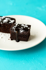 Vegan chocolate brownie on plate close up