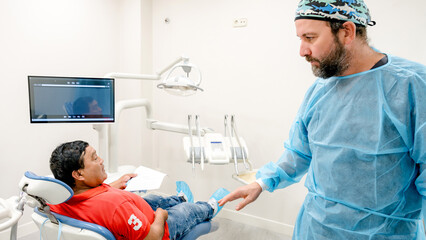 Patient consultation at modern dental clinic