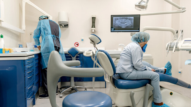 Dental professional with patient in modern clinic setting