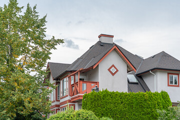 Top of luxury house with shingle roof and nice windows in Summer in Vancouver, Canada, North America. Day time on August 2025.