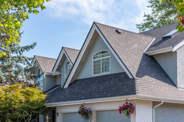 Top of luxury house with shingle roof and nice windows in Summer in Vancouver, Canada, North America. Day time on August 2025.