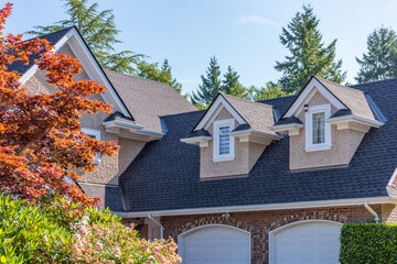 Top of luxury house with shingle roof and nice windows in Summer in Vancouver, Canada, North America. Day time on August 2025.