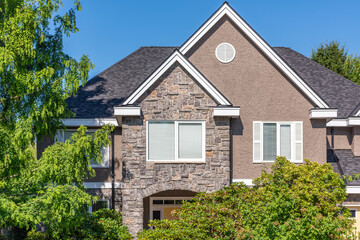 Top of luxury house with shingle roof and nice windows in Summer in Vancouver, Canada, North America. Day time on August 2025.