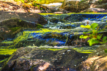 Landscape still shot of the Dure River in Brousse and Villaret in the South of France. Small waterfalls and undergrowth in Occitanie.
