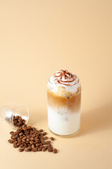 Various coffee drinks with chocolate truffles, beans and milk on beige background. Cozy flat lay for cafes, baristas, dessert menus, social media and coffee branding.