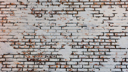 Weathered Brick Wall: A textured brick wall showcases the beauty of age, with peeling paint that reveals layers of history. The rough surface tells a story of time, creating a captivating.