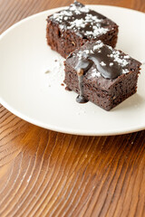Vegan chocolate brownie on plate close up