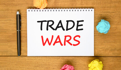 Trade wars symbol. Concept word Trade wars on beautiful white note. Black pen, colored paper....