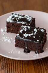 Vegan chocolate brownie on plate close up