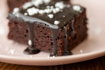 Vegan chocolate brownie on plate close up