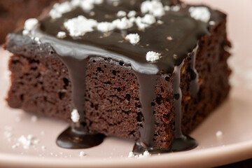 Vegan chocolate brownie on plate close up
