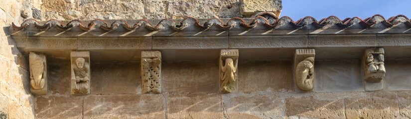 Series of Romanesque corbels with sculpted figures in El Salvador Church Pozancos Palencia