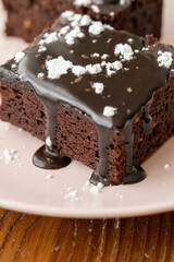 Vegan chocolate brownie on plate close up