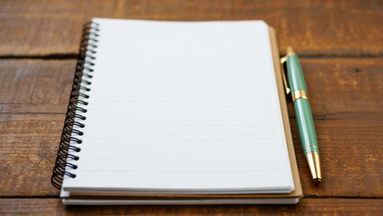 Blank spiral notebook and pen on rustic wooden table