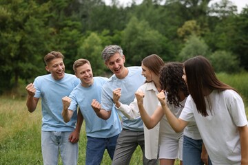 Team building. Group of happy people together outdoors