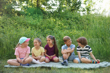 Obraz premium Children spending time in nature on summer day