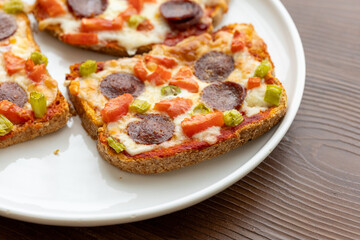 Italian bruschetta pizza made with toasted diet bread