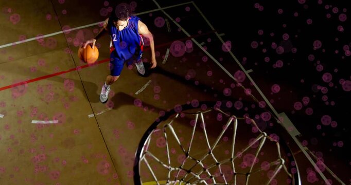 Athlete dribbling ball triggers animated purple lights highlighting dunk motion in sports training