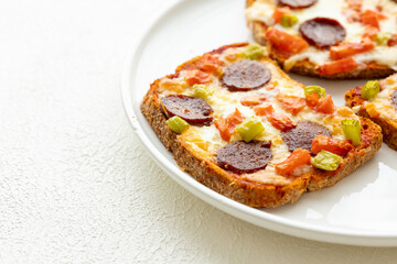 Italian bruschetta pizza made with toasted diet bread