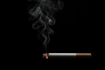 Swirling smoke from a lit cigarette against a dark background in a dimly lit setting