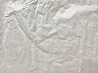 wrinkled white parchment paper texture with soft fibers and subtle creases for packaging or vintage design background

