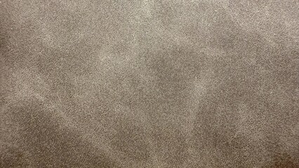 soft brown suede leather texture with subtle grain pattern for upholstery or digital design background

