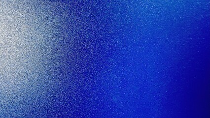 textured royal blue metallic surface with subtle gradient lighting ideal for background designs or tech product mockups

