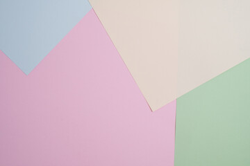 Abstract texture of colored paper. Geometric shapes and lines in bright colors. Place for text. Multicolor abstract flat lay. Copy space, top view