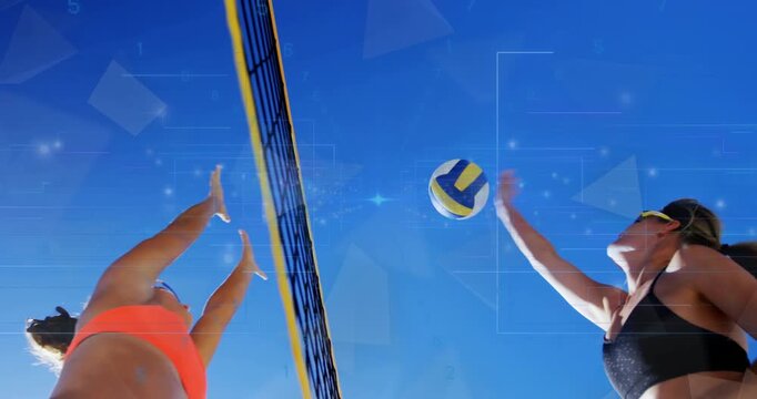 Incoming ball arcing above net triggers leaping sports players blocking and spiking on beach court