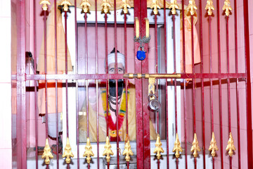 Locked Temple Gate with Idol Inside