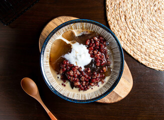 Red Bean Soup with Aiyu Jelly and Cream in Bowl side view of taiwan food